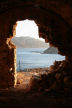 Kalymnos - looking down the west coast of Kalymnos from the derelict chapel on the shoulder of the hill above Emborios in the evening light