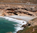 Kalymnos - one of the small remote bays around the headland from Emborios, this one fenced off to keep the goats on it; any people who find their way to it have to settle for a short section of the beach - or share