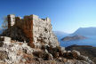 Kalymnos 019 - remains of the ancient dressed stone construction of the Kastri with Telendos Island and the west coast of Kalymnos in view beyond