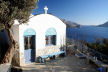 Kalymnos - the small chapel just after Skalia on the roadside and cliff edge at the point where the track goes off to Palionissos, looking down the island's West coast at the end of the afternoon