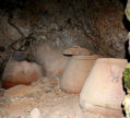 Nisyros - restoration work at the monastery of Armas has preserved this example of storage jars in part of an ancient dwelling built into the rock, maximising cool conditions optimal for conserving food stocks