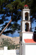 Symi - the bell tower at the entrance to Agia Ekaterini with 'Upper' Ksisos below in the background
