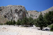 Symi - the secluded Lapathos beach at the foot of the Vasilios Gorge below the cliff-top Agios Vasilios monastery