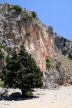 Symi - cliff at Lapathos Beach with fenced off animal water-hole at the base (not potable for humans)