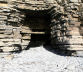 the sea-caves are formed by collapsing rock strata, here leaving behind a massive 'lintel'