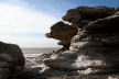 lower cliffs sculpted by wave action